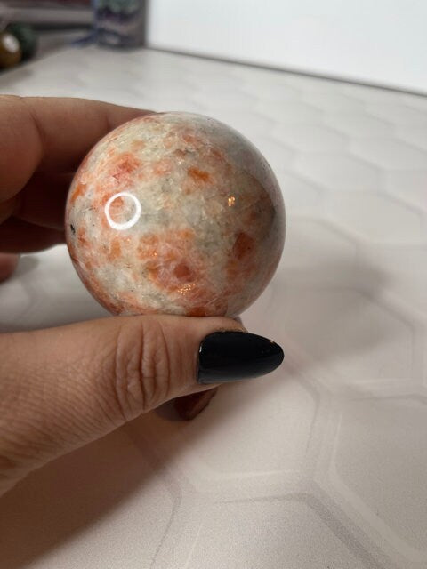 Sunstone Sphere in hand